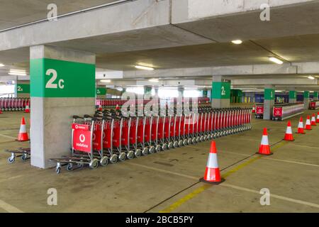 Sydney, Australia. 04th Apr, 2020. As the Australian airline industry faces an increasingly uncertain future as a result of the impact of the COVID-19 Coronavirus, the carpark at Sydney International Airport has become empty of air travellers and their cars and holds hundreds of now un-needed passenger baggage trolleys. Credit: Robert Wallace/Alamy Live News Stock Photo