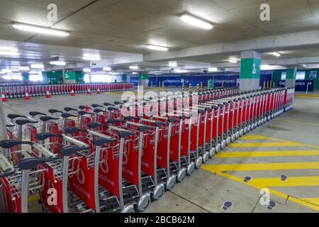 Sydney, Australia. 04th Apr, 2020. As the Australian airline industry faces an increasingly uncertain future as a result of the impact of the COVID-19 Coronavirus, the carpark at Sydney International Airport has become empty of air travellers and their cars and holds hundreds of now un-needed passenger baggage trolleys. Credit: Robert Wallace/Alamy Live News Stock Photo