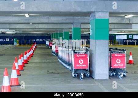 Sydney, Australia. 04th Apr, 2020. As the Australian airline industry faces an increasingly uncertain future as a result of the impact of the COVID-19 Coronavirus, the carpark at Sydney International Airport has become empty of air travellers and their cars and holds hundreds of now un-needed passenger baggage trolleys. Credit: Robert Wallace/Alamy Live News Stock Photo