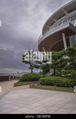part of Nurimaru APEC House and its grounds on gloomy day with cloudy skies Stock Photo