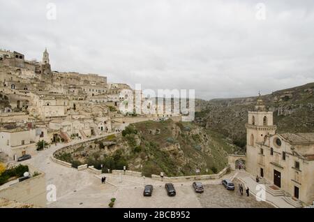 MATERA, ITALY - 4 SEP 2017: Panorama of Italian city Matera, showing the famous medieval town built on a rock, with churches and intricate houses, in Stock Photo