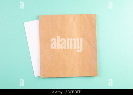 A sheet of craft paper on a mint background Stock Photo