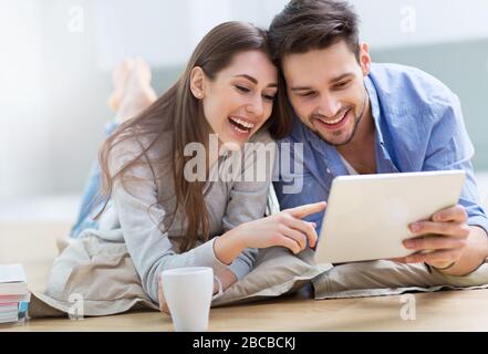 Couple using laptop together Stock Photo