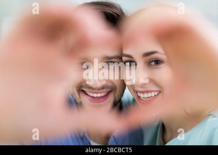 Young couple hugging at home Stock Photo