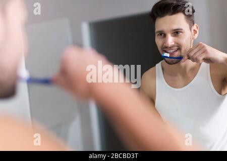 Man brushing teeth Stock Photo