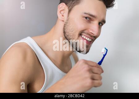 Man brushing teeth Stock Photo