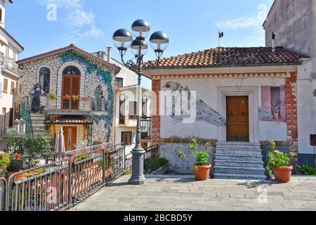 A narrow street between the houses of a small mountain village in the Basilicata region in Italy Stock Photo