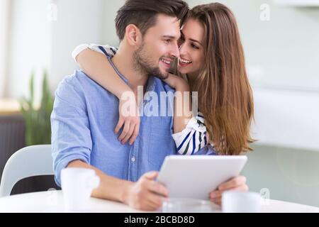 Couple using laptop together Stock Photo