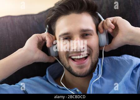 Young man enjoying music Stock Photo