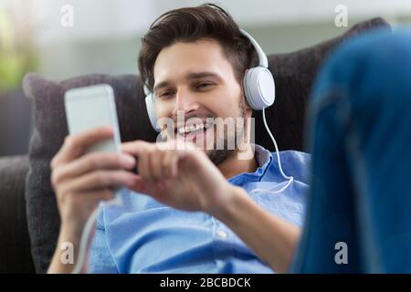 Young man enjoying music Stock Photo