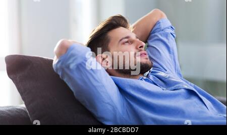 Young man relaxing at home Stock Photo