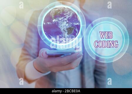 Conceptual hand writing showing Web Coding. Concept meaning work involved in developing a web site for the Internet Elements of this image furnished b Stock Photo
