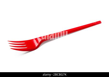 Red plastic disposable fork isolated on white background Stock Photo