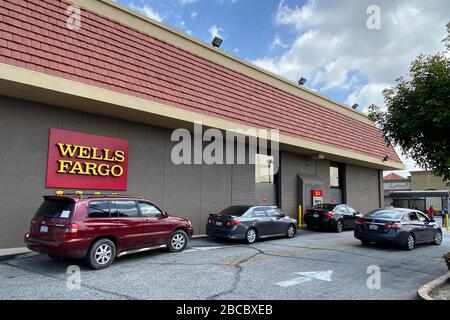Cars wait in line at drive-thru automatic teller machine at Wells Fargo Bank amid the global coronavirus COVID-19 pandemic, Friday, April 3, 2020, in Monterey Park, California, USA. (Photo by IOS/Espa-Images) Stock Photo