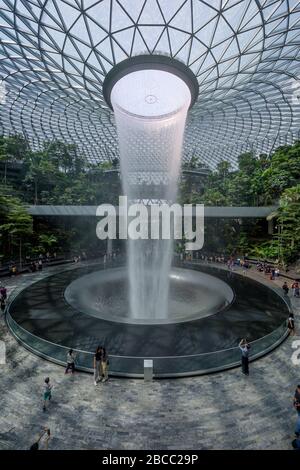 Singapore-30 Aug 2019: Jewel Changi Airport is a new terminal building  under a glass dome, with indoor waterfall and tropical forest, shopping malls Stock Photo