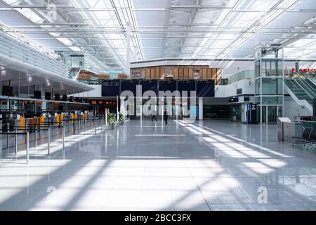 Munich, Germany. 03rd Apr, 2020. Only a few people are seen in Terminal 2 of Munich Airport. As a result of the corona pandemic, air traffic has largely come to a standstill. Credit: Sven Hoppe/dpa/Alamy Live News Stock Photo