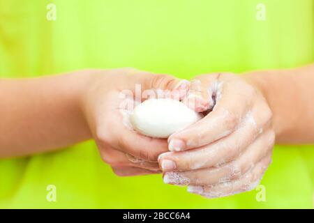 Front view on womans hands with soap foam, personal hygiene concept Stock Photo