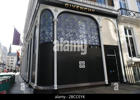 The shutters are down at the Givenchy store in Bond Street during the COVID-19 London pandemic and lockdown on 4th April 2020 Stock Photo
