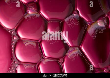 Artistic Colorful purple oil and soap bubbles in water Stock Photo