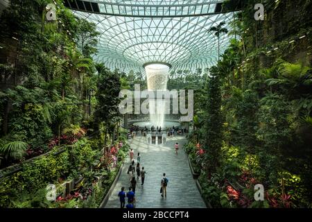 Singapore-30 Aug 2019: Jewel Changi Airport is a new terminal building under a glass dome, with indoor waterfall and tropical forest, shopping malls a Stock Photo