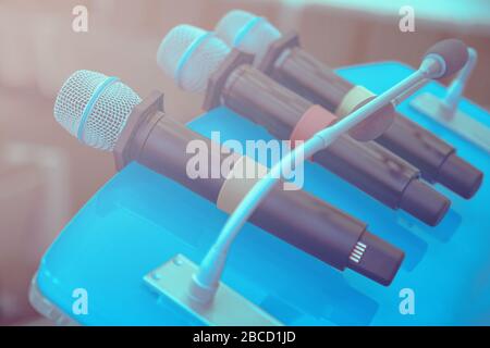 Wireless microphones on the table. Close up of microphones in conference room. Business conference. Stock Photo