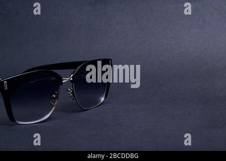 Black sunglasses on black background close up, copy space Stock Photo