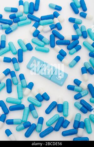 NHS letters tiles & assorted blue pills. For NHS 75th birthday, NHS heroes, NHS prescriptions, UK National Health Service, medicine in UK Stock Photo