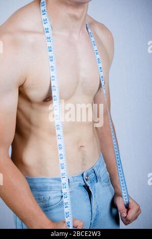 Muscular Man Measuring Waistline Stock Photo by ©AndreyPopov 97934424