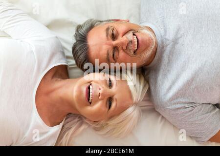 Senior couple in bed together Stock Photo