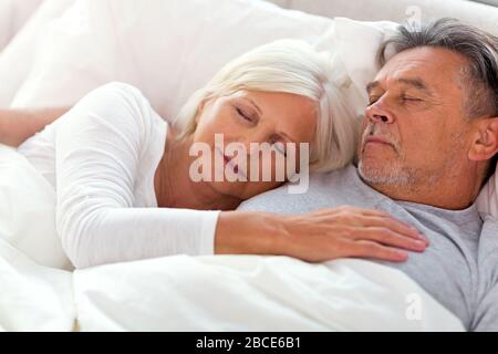 Senior couple in bed together Stock Photo