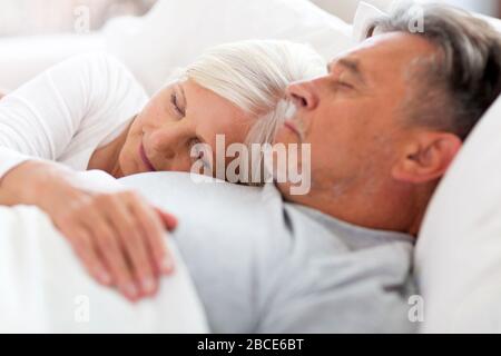 Senior couple in bed together Stock Photo