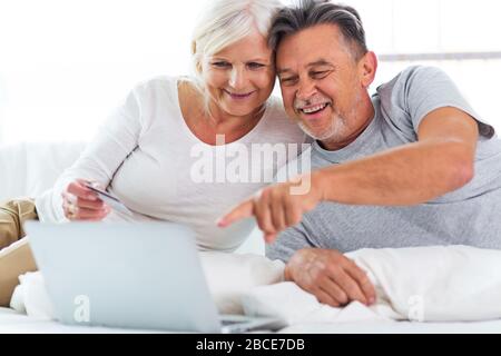 Senior couple using laptop Stock Photo