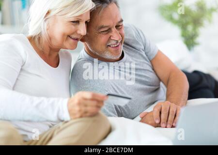 Senior couple using laptop Stock Photo
