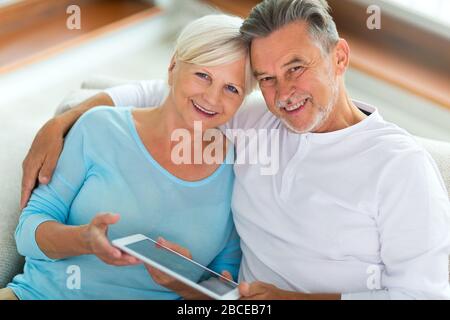 Senior couple using laptop Stock Photo