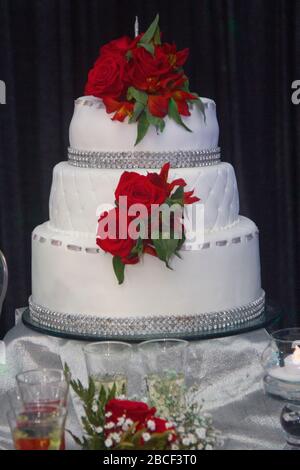 Cake of a celebration. Beautiful cake with red roses. Stock Photo