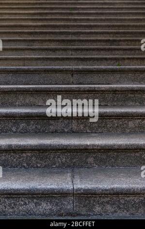 Section of a granite staircase with many steps as background Stock Photo