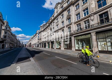 London, UK. 4th Apr 2020. Regent Street is very quiet, but not empty - A sunny day and people are out in reasonable numbers, throughout London, to get their daily exercise. The 'lockdown' continues for the Coronavirus (Covid 19) outbreak in London. Credit: Guy Bell/Alamy Live News Stock Photo