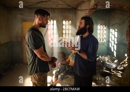 CHRIS HEMSWORTH and SAM HARGRAVE in EXTRACTION (2020), directed by SAM HARGRAVE. Credit: Netflix / AGBO / India Take One Productions / T.G.I.M Films / Album Stock Photo