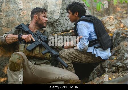 CHRIS HEMSWORTH and RUDHRAKSH JAISWAL in EXTRACTION (2020), directed by SAM HARGRAVE. Credit: Netflix / AGBO / India Take One Productions / T.G.I.M Films / Album Stock Photo