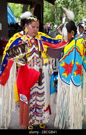 Indian Chief in dress at North American Plaims Native Indian in traditional dress at Pow Wow in the Indian Village at the Calgary Stampede Stock Photo