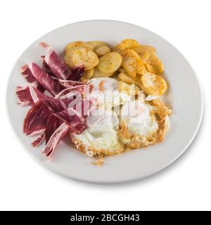 Plate of broken eggs with ham and potatoes. Stock Photo