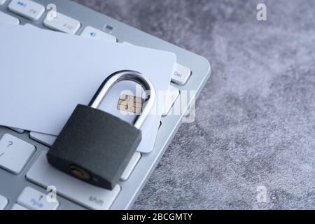 lock and credit card on the computer keyboard Stock Photo