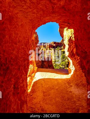 Arch opening in the Vermilion Colored Hoodoos on the Navajo Trail in Bryce Canyon National Park, Utah, United States Stock Photo