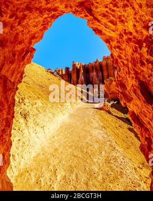 Arch opening in the Vermilion Colored Hoodoos on the Navajo Trail in Bryce Canyon National Park, Utah, United States Stock Photo