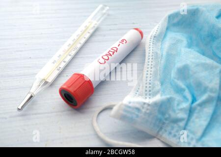 Close up of blood test tubes, face mask, Blood positive test to coronavirus Stock Photo
