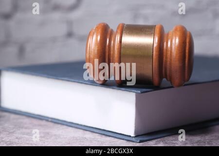 Close up of gavel on a book on table  Stock Photo