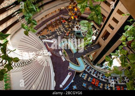 Inside Marina Square, Singapore. Raffles Avenue Entrance. Marina Mandarin Oriental Hotel in background Stock Photo