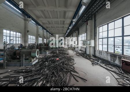 Interior of an old abandoned industrial steel factory Stock Photo