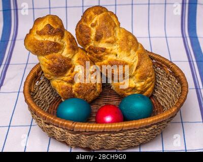 Easter breads with eggs in the basket Stock Photo