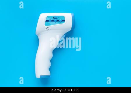 Thermometer gun for measuring temperature. Infrared non contact electronic thermometer, COVID-19 testing. Concept of pandemic of coronavirus Stock Photo